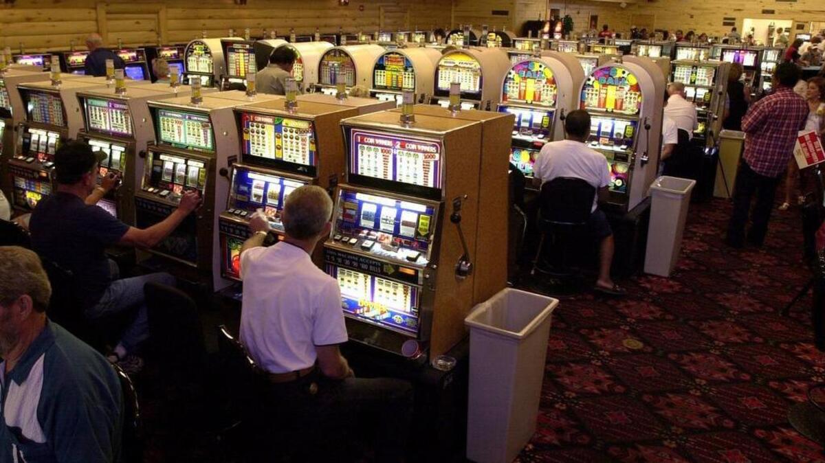 Patrons of the Alabama-Coushatta Entertainment Center played the slot machines Thursday, July 25, 2002, on the Alabama-Coushatta Reservation, east of Livingston, Texas. After being open for several months, the State of Texas shut the Reservation casino down.